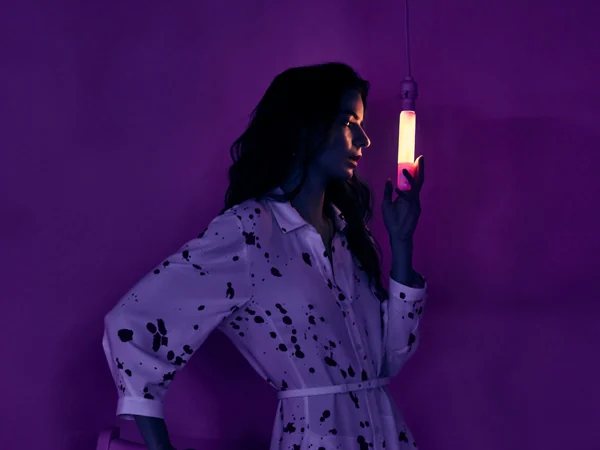 Portrait in a neon-lit art environment from Jeremy Penn’s Saks portfolio